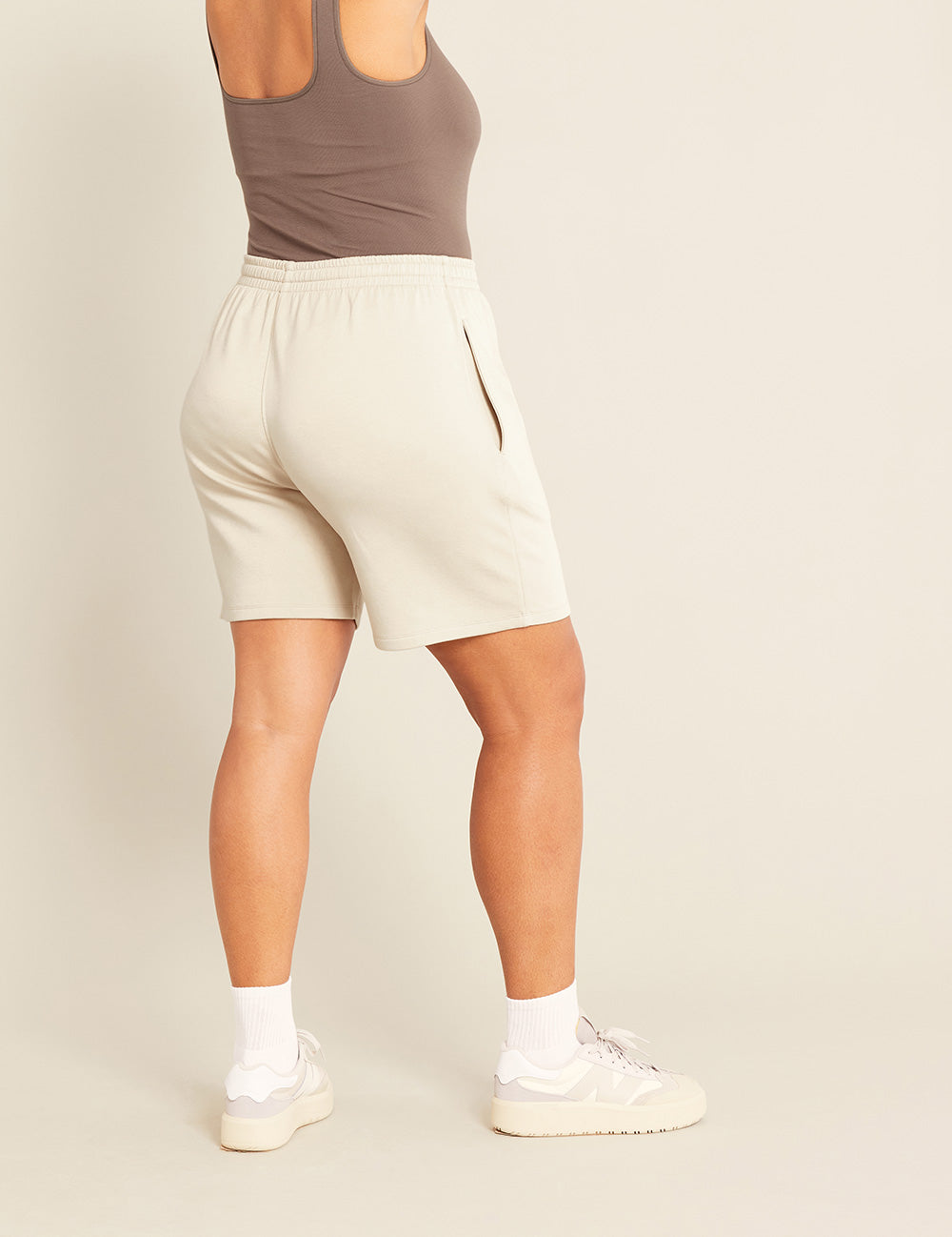 Gender-Neutral-6_-Sweat-Shorts-Sand-Female-Back.jpg