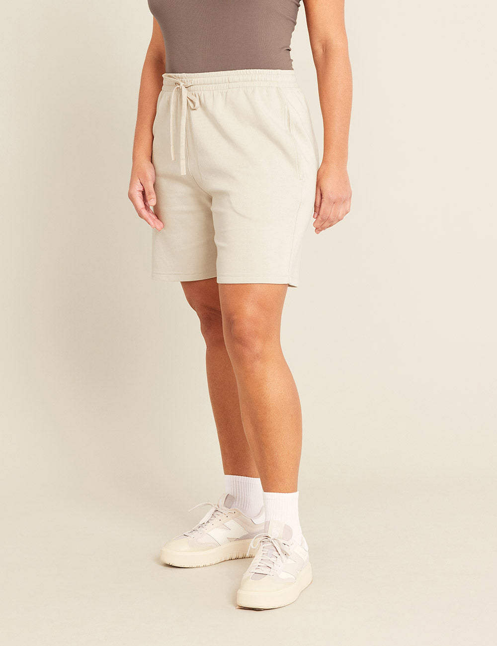 Gender-Neutral-6_-Sweat-Shorts-Sand-Female-Side.jpg