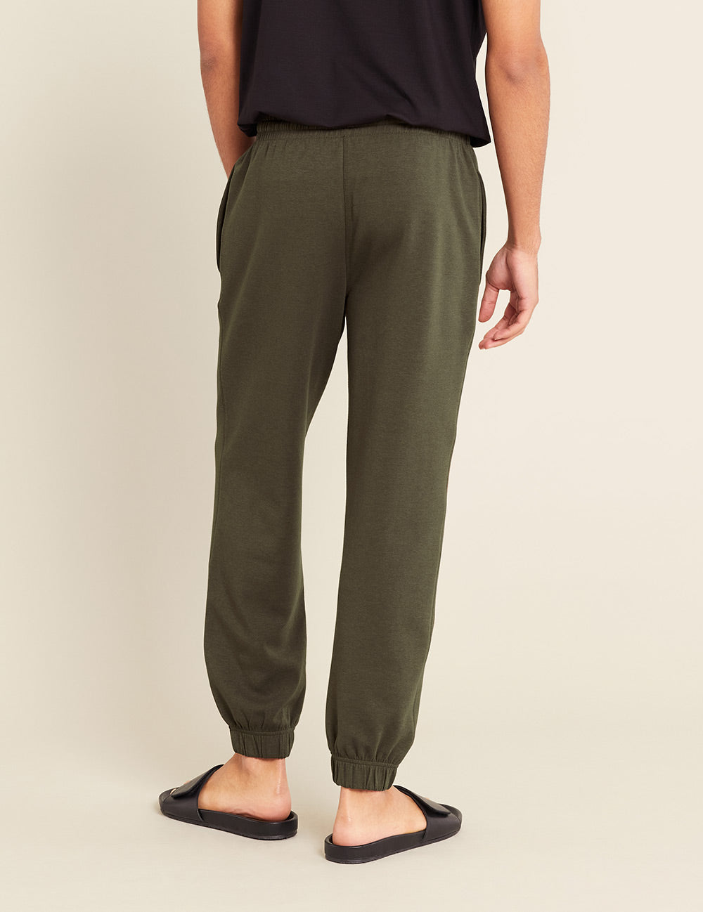 Gender-Neutral-Cuffed-Sweat-Pants-Dark-Olive-Male-Back.jpg